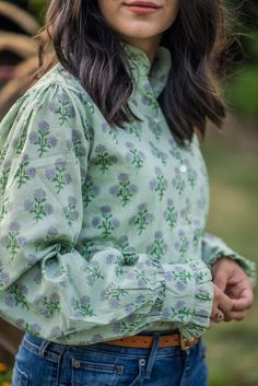 Available in Graciosa, this hand block print blouse with ruffles is the solution to your wardrobe woes. Teresa is a flowy, cotton blouse with functional shell buttons up the front and long, button-cuff sleeves. Cute ruffles at the neck and cuffs give Teresa a splash of personality. Wear it tucked in to show off a stylish belt or untucked for loose and carefree styling. Ready to ship! Please allow 1-2 business days to process your order and ship. Details: 100% cotton Hand block print Handmade in Cotton Blouses, Cuff Sleeves, Printed Blouse, Ruffles, Block Print, Button Up, Wardrobe, Fashion Outfits, Clothes Design