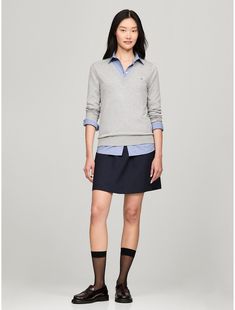 Tommy Hilfiger women's sweater. Made from a silky-smooth viscose blend, our versatile V-neck sweater is the wear-anywhere layer you'll be reaching for all season.  Material: 70% Sustainable Viscose (scv), 30% Polyamide. Classic V-neck Sweater For Spring Layering, Spring V-neck Sweater For Work, Casual Solid Color V-neck Sweater For Work, Tommy Hilfiger V-neck Winter Top, Casual V-neck Sweater For Business Casual, Spring V-neck Sweater For Workwear, Spring V-neck Sweater For Business Casual, Tommy Hilfiger Long Sleeve Sweater For Spring, Tommy Hilfiger Tops For Office In Fall