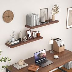 a laptop computer sitting on top of a wooden desk next to two shelves filled with books