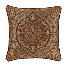 a brown and tan pillow with an intricate design