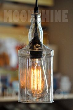 an old fashioned light bulb hanging from a ceiling