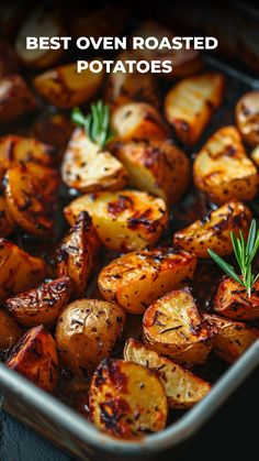 roasted potatoes with rosemary garnish in a roasting pan text reads best oven roasted potatoes