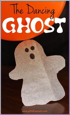 a paper ghost with the words, the dancing ghost on it's face and an orange balloon in the background