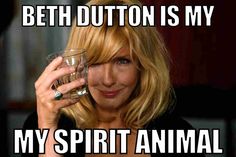 a woman holding a glass with the caption, beth button is my spirit animal