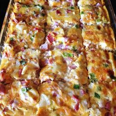 a casserole dish with meat, cheese and vegetables on the top is ready to be eaten