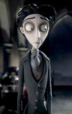 a cartoon character with big eyes and black hair wearing a gray suit, standing in front of a dark background