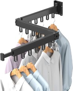 clothes hangers are hanging on the rail to hold shirts and other items in place