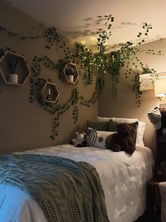 a bedroom with plants hanging on the wall