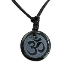 Carved from dark green jade â so dark it seems black â the Om symbol of Lord Shiva flourishes like ancient calligraphy. This mantra is used in mystical contemplation of ultimate reality and is considered the resonant body of the absolute. From Jorge Lopez the elegant pendant is worn on a black leather necklace. Its length can be adjusted by sliding the knots along the cords.Please note: Etched image may fade somewhat over time as a result of absorbing body oils and/or skincare products. Simp Engraved Spiritual Black Jewelry, Engraved Black Spiritual Jewelry, Spiritual Black Necklace For Festivals, Adjustable Spiritual Obsidian Jewelry, Symbolic Black Jewelry For Gift, Symbolic Black Jewelry For Gifts, Adjustable Black Amulet Necklace, Traditional Black Engraved Necklace, Black Spiritual Necklace For Meditation