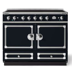 a black stove top oven sitting on top of a white countertop with two burners