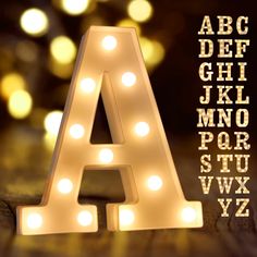 PRICES MAY VARY. Specification: Light up letters?size approx (W x H x D): 3.03" x 8.54" x 1.69" Made environmental ABS + PP material, requires no outlet, uses 2AA batteries(NOT included). Hanging holes and On/ Off switch on the back. Marquee letters with lights?can be displayed stand alone or hang on the wall. Easy to Use: Marquee letters with lights?(26 Alphabet letters and & symbols) provide endless possibilities of creating message. Spell out any name or phrase with these fabulous light up al White Led Letter Lights, Initials Lights Wedding, Christmas Lights With Names, Wall Letter Lights, L.e.d. Lights, Love Lights Wedding Letters, Metal Letter Lights, Light Up Letters Wedding Table, Lights For Signs