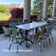 an outdoor dining area with tables and chairs