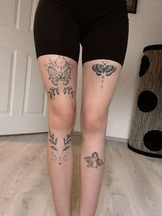 the legs of a woman with tattoos on her leg and butterfly tattoo on their thighs