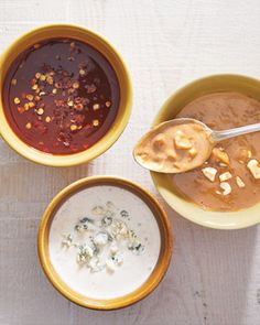 three bowls filled with different types of food