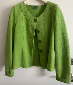 Thank you for visiting my store! I just love this refreshing bright green Boiled Wool Button Up Sweater Jacket Size  from Geiger, made and purchased in Austria.  It is made of 100% pure virgin Laine Wool.   It has bright green buttons.  It is unlined and would look great with white pants or skirt for a day at the races! Very warm and comfy for summer chilly nights. Great details make this Geiger cardigan a bit above the usual. Collarless with bright green  buttons down the plain front and a nipp Green Spring Outerwear With Buttons, Casual Green Winter Blazer, Casual Green Blazer For Winter, Green Workwear Outerwear With Button Cuffs, Green Spring Outerwear With Snap Buttons, Green Outerwear With Button Cuffs For Work, Green Spring Blazer With Buttons, Green Outerwear With Snap Buttons For Spring, Green Blazer With Buttons For Spring