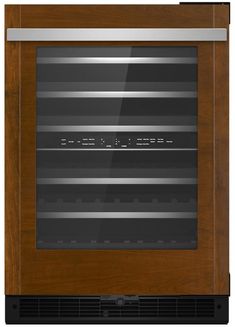 an oven that is built into the side of a wooden cabinet with stainless steel trimmings