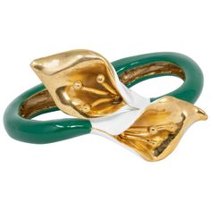 Flower chic cuff bracelet from Oscar de la Renta. A white and green enamel calla lily in gold. Gold plated. Get the matching pin and ring! Tags, Marks, Hallmarks: Oscar de la Renta, Made in USA Inner diameter at widest part: 5.9 cm / 2.3 in Green Enamel, Gold Enamel, Calla Lily, White Enamel, Gold Gold, Cuff Bracelet, Jewelry Bracelets, Gold Plate, Lily