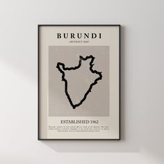 a framed poster hanging on the wall with a map in it's center frame