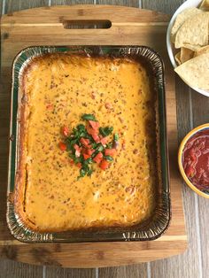 a casserole dish with tortilla chips and salsa