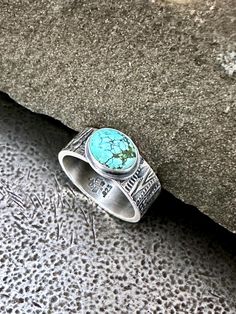 Size 9 ring featuring an oval Kingman Turquoise cabochon with hand stamped woodgrain textured Sterling silver band and oxidized satin finish.  Turquoise cabochon measures approximately 10mm/8mm. Sterling band measures approximately 8mm wide-1.75mm thick. I hand fabricate my work from solid Sterling Silver using traditional metalsmith tools and techniques. Ready to Ship! All items gift boxed. Adjustable Stamped Turquoise Ring In Sterling Silver, Hand-strung Turquoise Sterling Silver Jewelry, One-of-a-kind Silver Turquoise Ring Gift, Unique Silver Turquoise Nickel-free Ring, Tree Bark Texture, One-of-a-kind Silver Turquoise Ring In Sterling Silver, Kingman Turquoise, Tree Bark, Sterling Silver Bands