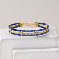 Ross-Simons - Lapis Bead, Snake-Chain Bracelet in 18kt Gold Over Sterling. 7". Offering a regal look, our three-strand bracelet features a gleaming 18kt yellow gold over sterling silver snake chain nestled between two rows of 3mm round faceted lapis beads. Includes a 1" extender. Natural pyrite flecks in lapis will vary. Lobster clasp, lapis bead snake-chain bracelet. Luxury Gold Beaded Gemstone Bracelets, Gold Beaded Lapis Lazuli Bracelets, Gold Lapis Lazuli Bracelet With Gemstone, Luxury Gold Beaded Bracelets With Gemstones, Luxury Gold Beaded Bracelet With Gemstones, Gold Lapis Lazuli Gemstone Bracelet, Luxury Gold Bracelets With Gemstone Beads, Elegant Yellow Gold Bracelets With Gemstone Beads, Elegant Yellow Gold Beaded Bracelets With Gemstones