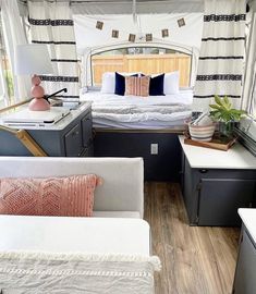 the inside of a camper with lots of furniture