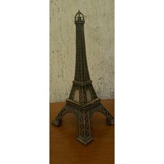 a small metal model of the eiffel tower