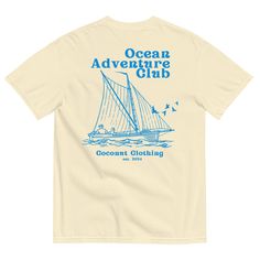 Set sail on a journey of endless ocean adventures with our Ocean Adventure Club Graphic T-Shirt! This design features two adventurers on a sailboat navigating the waves, with birds soaring overhead, capturing the spirit of nautical exploration. The top text reads "Ocean Adventure Club" and the bottom text proudly displays "Coconut Clothing Co.," making this tee perfect for those who love the sea and the thrill of adventure. -If you're looking for a thick, structured tee that's also super soft and breathable--look no further! The unisex garment-dyed heavyweight t-shirt ticks all the boxes and is made of 100% ring-spun cotton. The regular t-shirt style will complement most looks and fit you to a tee. * 100% ring-spun cotton * Fabric weight: 6.1 oz/yd² (206.8 g/m²) * Garment-dyed * Relaxed fi Embroidery Tee Shirts, Coconut Clothes, Endless Ocean, Ocean Adventure, Text Tshirt, Adventure Club, Boat Shirts, Tropical Fashion, New Embroidery