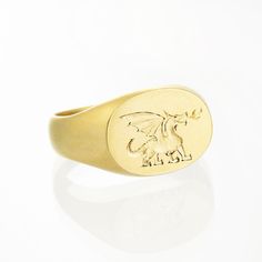 Solid 14K / 18K yellow, white or rose gold custom engraved signet ring for women. Minimalist and modern personalized signet ring made of solid gold. This beautiful signet ring can be customized just for you by adding a detailed hand engraved design - instead of the dragon. It can be initials, name, date, insignia or illustration of your choosing. Contact me for a quote. This ring can be used also as a pinky or an alternative wedding ring. It is perfect for everyday wear and will go with any look White Gold 14k Stamped Signet Ring, 14k Gold Round Signet Ring, 14k Gold Tarnish Resistant Signet Ring, Yellow Gold Oval Signet Ring Hallmarked, Yellow Gold Oval Hallmarked Signet Ring, Hallmarked Oval Yellow Gold Signet Ring, Oval Yellow Gold Hallmarked Signet Ring, Engraved Gold Sterling Silver Rings, Rose Gold Sterling Silver Open Signet Ring