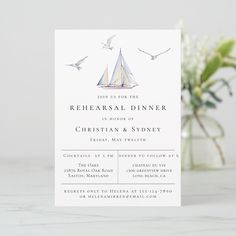 a white card with a sailboat on it and birds flying over the boat in the background