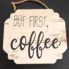 a sign that says but first, coffee