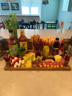 a tray filled with lots of different types of food on top of a kitchen counter