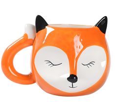 an orange and white mug with a fox face on it's side, sitting in front of a white background