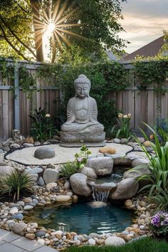 a buddha statue sitting in the middle of a small pond surrounded by rocks and plants