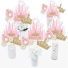 pink and gold princess birthday party decorations with cake toppers, centerpieces and cupcake picks