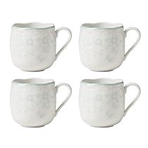 four white coffee mugs sitting next to each other