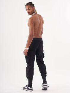 Soft low waist black joggers with 6 functional cargo pockets and elastic ankles. A flattering fit brings style while the premium fabric feels great on skin. FEATURES Slim Fit Made up of 95% Cotton and 5% Elastane Jogger comfort Drawstring waist SIZE GUIDE Model's height and weight: 6"1 feet & 180 lbs. (185 cm & 82 kg ) Model wears size: L Black Sports Joggers With Functional Pockets, Black Cargo Pocket Joggers For Streetwear, Black Moisture-wicking Joggers For Streetwear, Full-length Cargo Pocket Joggers For Streetwear, Black 4-way Stretch Functional Joggers, Joggers Black, Black Joggers, Low Waist, Height And Weight