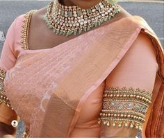 Size  Small      32-34 Medium 34-36 Large     38-40 Xl             40-42 XXL.        44-46 Product Details  Maggam work on Peach Rawsilk blouse  ( can be customized in other colours)  with all over hand embroidery , beads , stones , zardozi , resham in gold and detailing on front and back. Heavy back aari work blouse.  🧵Front: Deep neck with all around embroidery. Front open hooks.. 🧵Closure: Deep back neck with back tie up detailing.  🧵Can be mixed matched with a wide range of sarees 🧵Size refers to circumference around the fullest part of the bust 🧵Estimated Dispatch time: 7 to 15 working days. Contact us if it's an urgent order. Peach Colour Blouse Aari Work, Peach Blouse Design, Peach Colour Blouse Designs, Peach Colour Saree, Blouse Aari Work Design, Resham Work Embroidery, Hand Embroidery Beads, Peach Color Saree, Stone Work Blouse