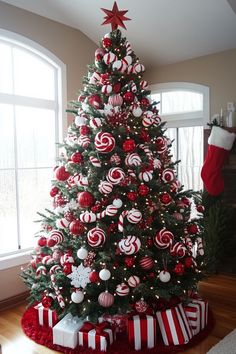 a christmas tree decorated with red and white ornaments