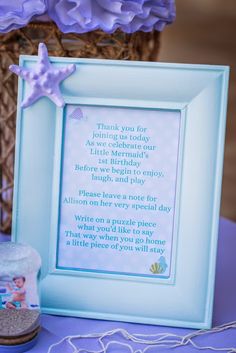 there is a blue frame with a poem on it and a starfish in the background