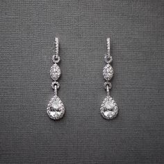 A timelessly chic design, featuring a cascading pair of pave-set teardrop and marquise stones. Offering a delicate, 1.5-inch length, these hypoallergenic earrings are plated with rhodium and exquisitely adorned with AAA CZ stones, free from lead, nickel, and cadmium. Drop Bridal Earrings, Silver Bridal Earrings, Bridal Earrings Drop, Hypoallergenic Earrings, Rose Gold Necklace, Bridesmaid Jewelry, Cz Stone, Bridal Earrings, Chic Design