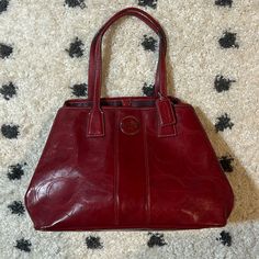 Women's Authentic Coach Red Kiss Lock Handbag Purse No. H1193-F15658 - Nwot. This Purse Has Dual Handles, The Coach Logo To The Front Of The Purse, To The Lower Side, To The Chain Hanging From The Strap At The Outside Of The Purse, And To The Inside Authentication. The Inside Has Three Distinct Sections. The Middle Section Has The Kiss Lock Closure And The Front And Back Sections Each Have A Snap Closure. To The Front Inner Section, There Are Two Open Pockets Where A Phone Could Be Stored And To Coach Burgundy Shoulder Bag For Everyday Use, Classic Red Coach Satchel, Coach Burgundy Shoulder Bag With Removable Pouch, Classic Red Satchel With Soft Leather, Coach Burgundy Satchel For Travel, Classic Red Shoulder Bag For Errands, Coach Burgundy Satchel Shoulder Bag, Coach Red Satchel For Everyday Use, Coach Red Satchel For Daily Use