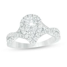 Graceful and glamorous, this diamond engagement ring radiates with your love. Crafted in 14K white gold, this beautiful choice features a dazzling 3/8 ct. diamond in a pear-shaped diamond composite - all wrapped in a diamond halo. The twist split shank sparkles with diamonds for an elegant finish. Enchanting with 1-1/4 cts. t.w. of diamonds and a brilliant buffed luster, this engagement ring sets the stage for your happily ever after. Pear Shaped Wedding Ring Silver, Pear Engagement Ring Twisted Band, Pear Shaped Engagement Rings White Gold, Pear Cut Diamond Engagement Ring, Pear Shaped Diamond Engagement Rings, Shank Engagement Ring, Engagement Rings Twisted, Pear Shaped Engagement Rings, Double Frame