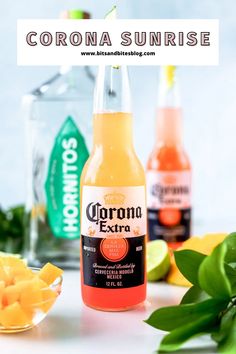 two bottles of corona sunrise next to some cut up fruit