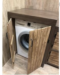 a washer and dryer in a small room