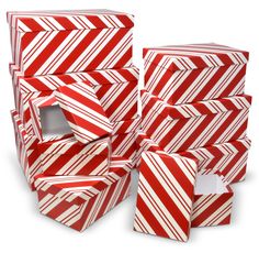 several red and white striped boxes stacked on top of each other, with one opening in the middle