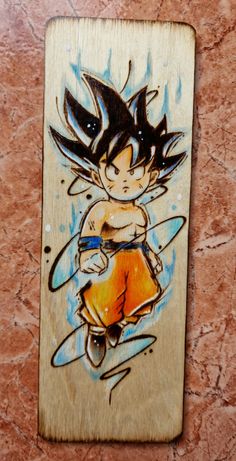 a wooden plaque with a drawing of a young gohan holding a surfboard on it