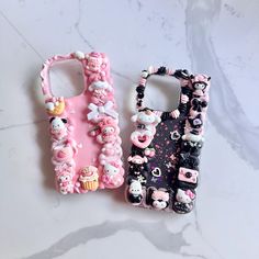 two cell phones with hello kitty cases on them