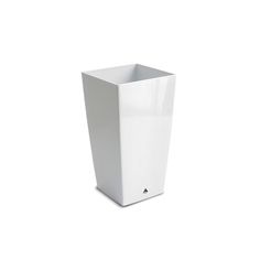 a white square vase sitting on top of a table