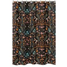 a black shower curtain with flowers and leaves on the outside, in front of a white background